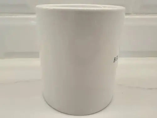 White ceramic container for Brigham Young University coffee mug display
