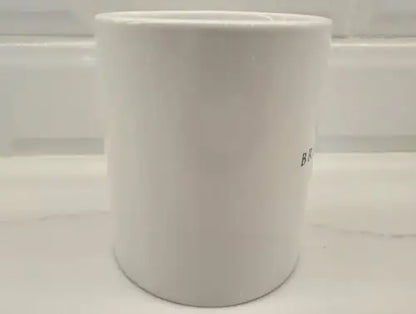 White ceramic container for Brigham Young University coffee mug display