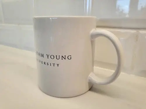 White ceramic Brigham Young University coffee mug for NCAA fans