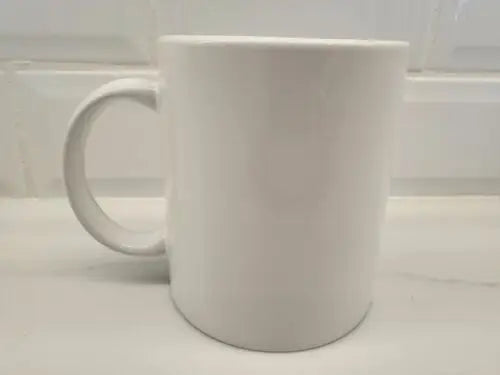Plain white ceramic coffee mug featuring Brigham Young University branding for fans