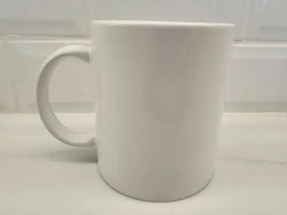Plain white ceramic coffee mug featuring Brigham Young University branding for fans