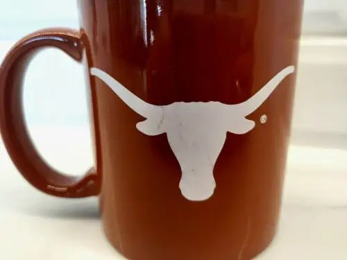 Burnt orange ceramic coffee mug with white Longhorn logo for NCAA University of Texas