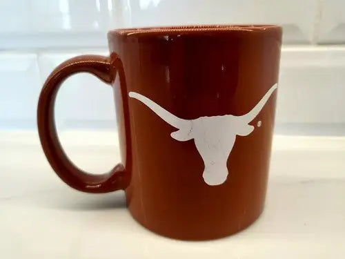 Burnt orange Texas Longhorns ceramic coffee mug featuring logo design