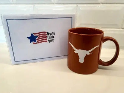 Burnt orange Texas Longhorns ceramic coffee mug with brown logo for NCAA fans