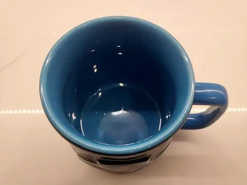 Blue ceramic mug featuring a Black 3D Sculpted Carolina Panthers logo design