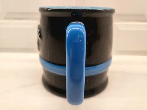 Black 3D sculpted Carolina Panthers ceramic coffee mug showcasing team spirit