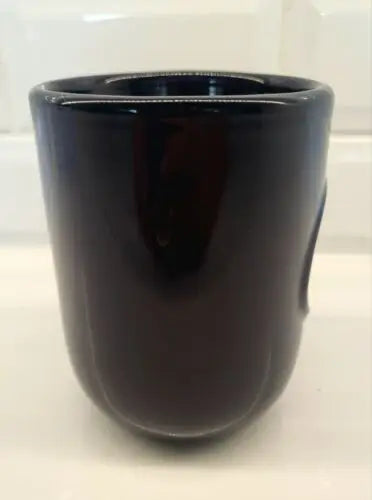 Dark glossy ceramic coffee mug featuring Tennessee Titans 3D logo relief design