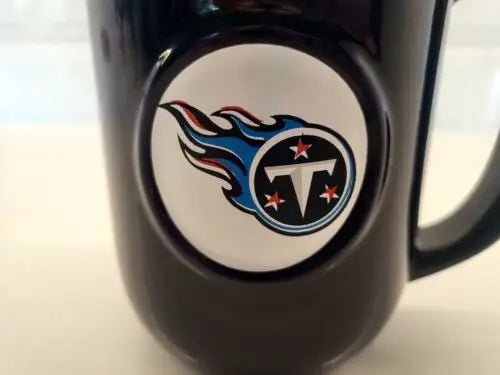 Black ceramic coffee mug featuring Tennessee Titans 3D logo relief design