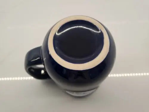 Dark blue ceramic coffee mug featuring Tennessee Titans 3D logo relief design