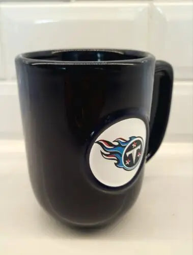 Dark blue ceramic coffee mug featuring Tennessee Titans 3D logo relief design