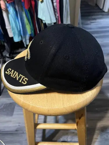 Black Orleans Saints NFL hat with gold embroidery for fans and sports enthusiasts