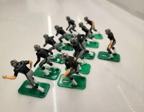 Miniature NFL 1970s Oakland LA Raiders football players in new black paint design