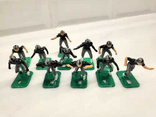 Miniature football player figurines from NFL 1970s Oakland LA Raiders Tudor set