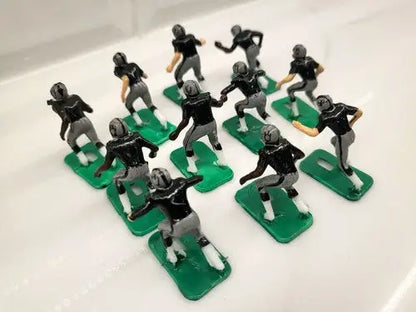 Miniature football player figurines of NFL 1970s Oakland LA Raiders in new black paint