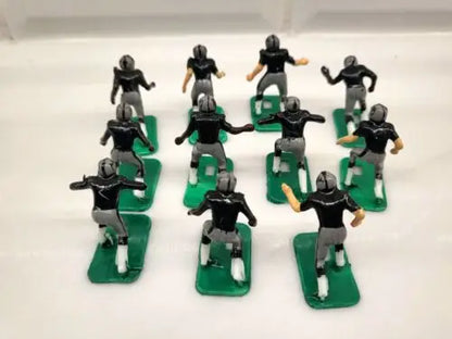 Miniature NFL 1970s football players of Oakland LA Raiders in new black paint