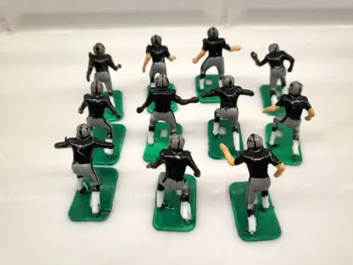 Miniature NFL 1970s football players of Oakland LA Raiders in new black paint