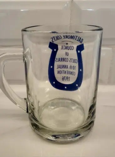 Clear glass beer stein featuring blue horseshoe design for Baltimore Colts fans