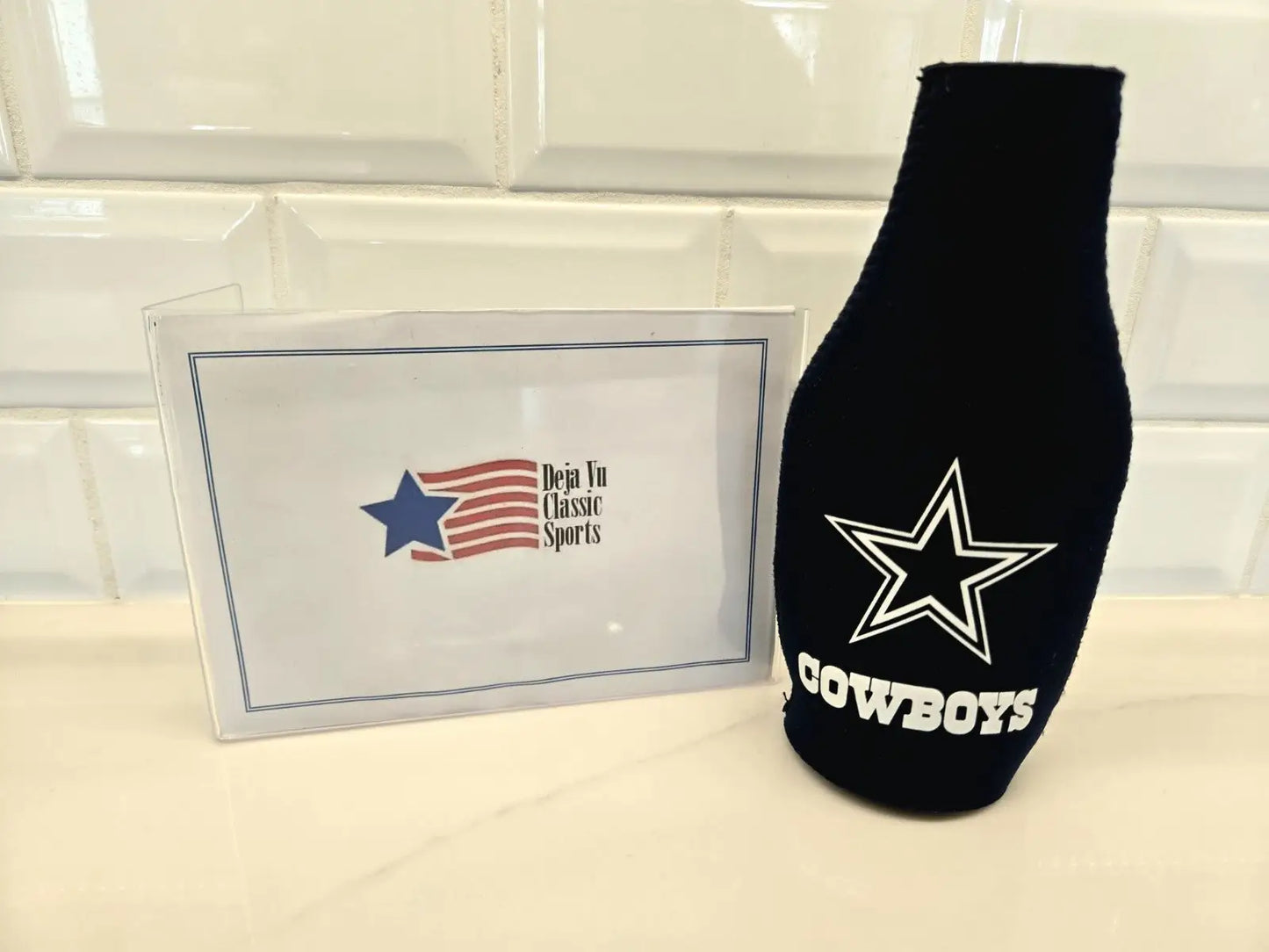 Black Dallas Cowboys bottle koozie for NFL Dallas Cowboys fans to keep drinks cold