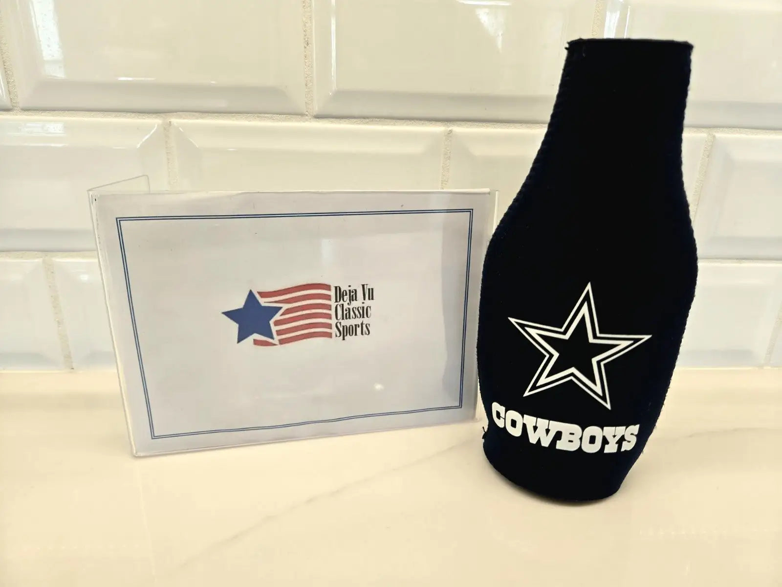 Black Dallas Cowboys bottle koozie for NFL Dallas Cowboys fans to keep drinks cold