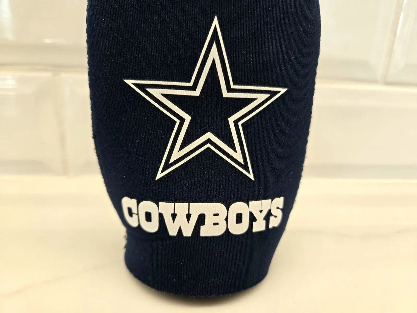 Navy blue Dallas Cowboys bottle holder koozie for NFL fans and beverages