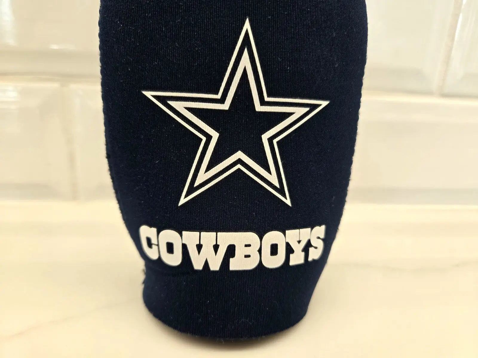 Navy blue Dallas Cowboys bottle holder koozie for NFL fans and beverages