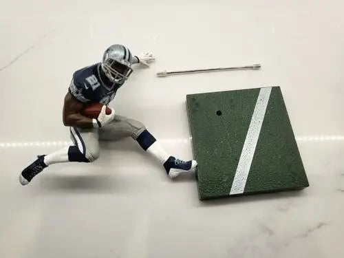 Dallas Cowboys Emmitt Smith loose action figure displayed in NFL McFarlane Ezekiel Elliott product