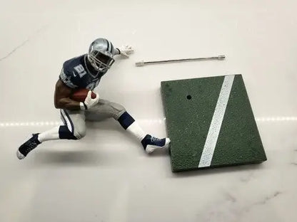 Dallas Cowboys Emmitt Smith loose action figure displayed in NFL McFarlane Ezekiel Elliott product