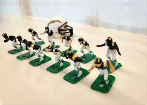 Miniature San Diego Chargers electronic football figures and helmet in blue uniforms
