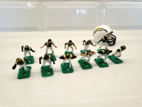 Miniature San Diego Chargers electronic football team with helmets in blue uniforms