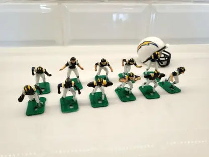 Miniature San Diego Chargers electronic football team with helmets in blue uniforms
