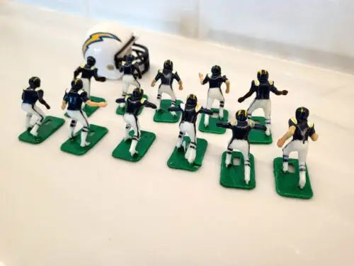 Miniature San Diego Chargers electronic football team with helmets in blue uniforms