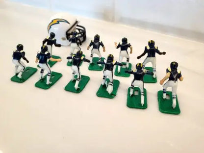 Miniature San Diego Chargers electronic football team with helmets in blue uniforms