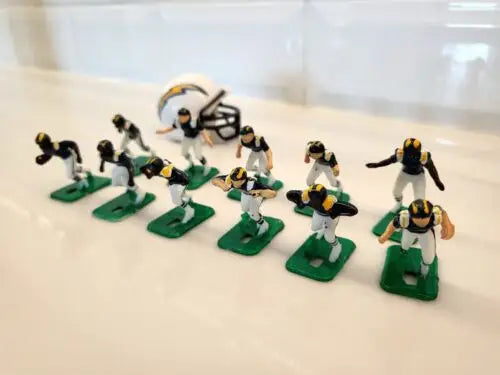 Miniature San Diego Chargers electronic football figures with helmet in blue uniforms