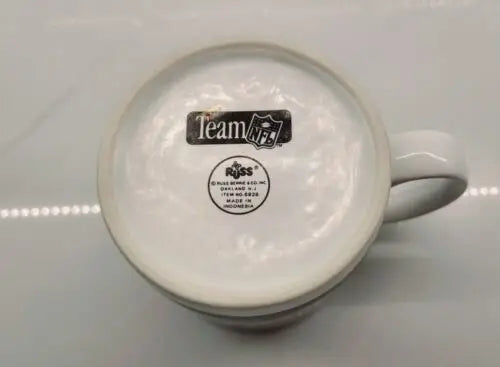 Bottom view of a York Jets green ceramic coffee mug with logo design