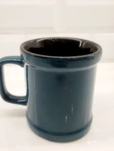 Dark blue ceramic mug with black interior, officially licensed Philadelphia Eagles design