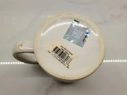 Bottom view of NFL Signed Tommy McDonald Ceramic Coffee Mug with vibrant stickers