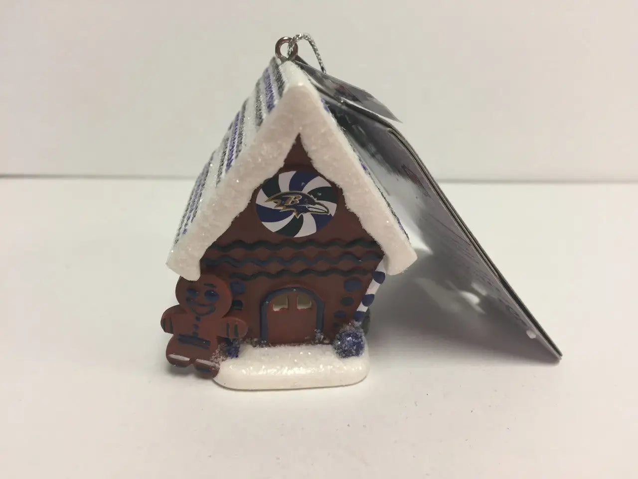 Miniature gingerbread house ornament with candy, part of NFL Team Gingerbread House collection