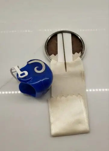 Vintage LA Rams helmet with white ribbon showcasing team spirit in NFL memorabilia