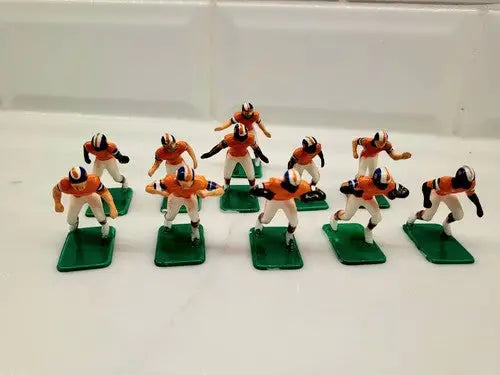 Miniature football figurines from NFL Vintage Tudor 11 Denver Broncos Electronic Football Set