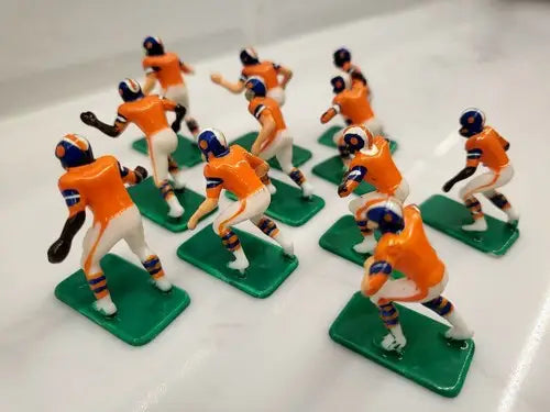 Orange and white Denver Broncos electronic football player figurines from NFL Vintage Tudor 11 set