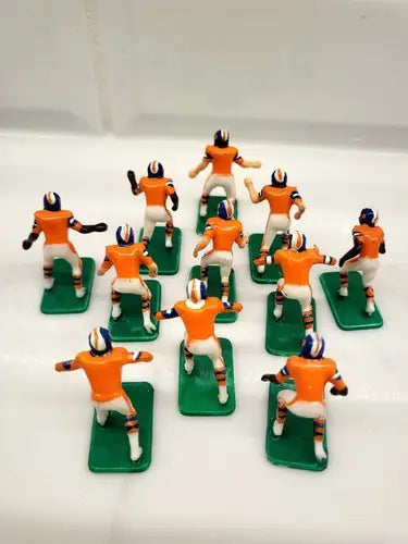 Miniature Denver Broncos electronic football figurines from the NFL Vintage Tudor 11 set