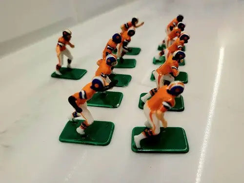 Vintage football figurines from NFL Vintage Tudor 11 Denver Broncos electronic football set
