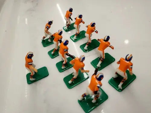 Vintage football figurines from the NFL Vintage Tudor 11 Denver Broncos Electronic Football Player Set