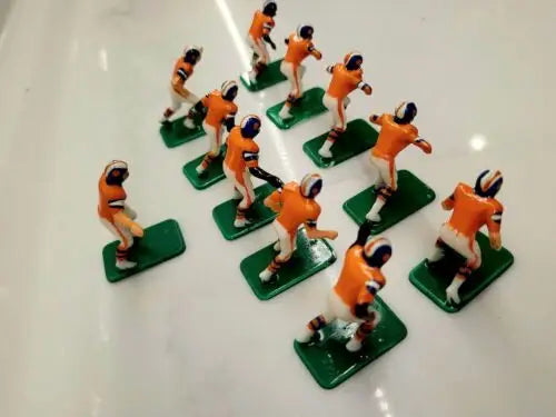 Vintage electric football figures from the Denver Broncos electronic football set