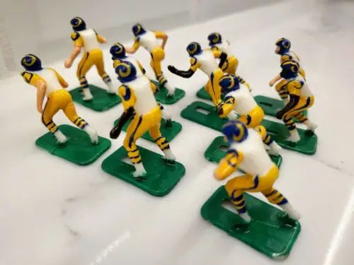 Miniature football figurines from the NFL Vintage Tudor 11 Los Angeles Rams Electronic set