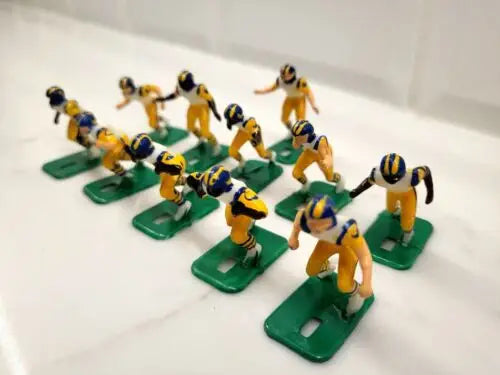 Miniature figures from the NFL Vintage Tudor 11 Los Angeles Rams Electronic Football set