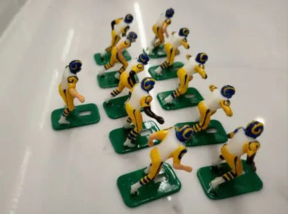 Miniature football figurines from the Los Angeles Rams Electronic Football Player Set