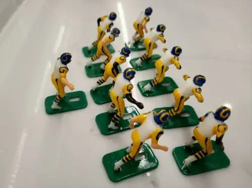 Miniature football figurines from the Los Angeles Rams Electronic Football Player Set