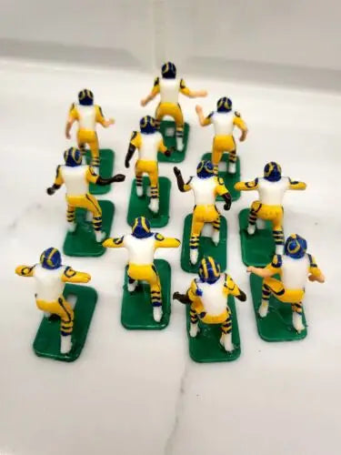 Miniature football player figurines from the Los Angeles Rams Electronic Football Set