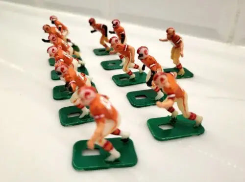 Vintage toy football players for NFL Buccaneers electronic football game display